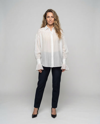 Women’s lightweight cotton blouse with gathered shoulder section.