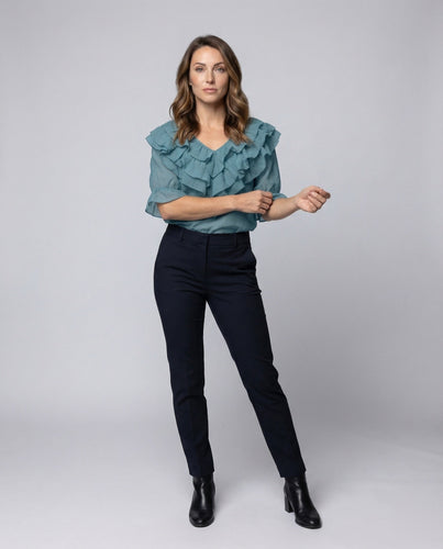 Ladies cropped shirt with knot front and three-quarter sleeves.