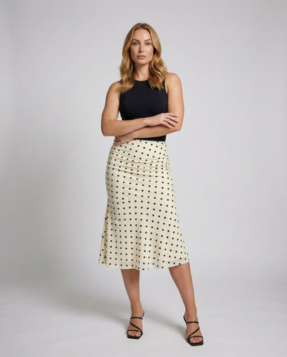 Women's fitted midi skirt with dot pattern