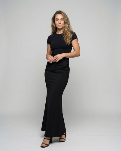 Women's body-hugging fishtail maxi skirt with draping