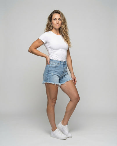 Women's high-waisted denim shorts with frayed hem