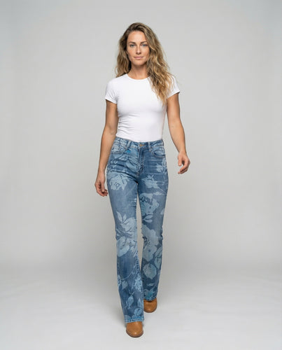 Women's flared jeans with floral bleaching effect